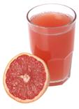Stock Photo titled: Fresh Grapefruit Half With Glass Of Grapefruit Juice., USE OF THIS IMAGE WITHOUT PERMISSION IS PROHIBITED